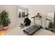 Exercise room including a treadmill, elliptical and floor mirror at 507 Ulster Way, Denver, CO 80230