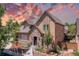 Charming two-story home with stone accents, a landscaped front yard, and an inviting entrance at 507 Ulster Way, Denver, CO 80230