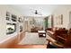 Bright and airy living room with wood floors, a fireplace, and plenty of natural light at 507 Ulster Way, Denver, CO 80230