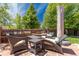 Inviting patio with comfortable lounge chairs, a table, and shaded seating area at 507 Ulster Way, Denver, CO 80230