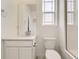 Bathroom features a marble floor, shower stall and a modern vanity at 8866 Waterleaf Ln, Littleton, CO 80125