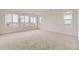 Bright and airy bedroom with neutral carpet, large windows with blinds, and ample light at 8866 Waterleaf Ln, Littleton, CO 80125