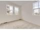 This bedroom has carpet and multiple windows at 8866 Waterleaf Ln, Littleton, CO 80125