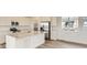 Modern kitchen features stainless steel appliances, quartz countertops, and ample cabinet space at 8866 Waterleaf Ln, Littleton, CO 80125