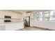 Contemporary kitchen featuring stainless steel appliances, white cabinets, and a large window at 8866 Waterleaf Ln, Littleton, CO 80125