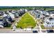 Aerial view of community with central green space, walkways, modern homes, and mountain views at 1500 Sun Way, Lafayette, CO 80026