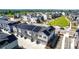 A residential community featuring townhouses with solar panels and garages, surrounded by green spaces at 1500 Sun Way, Lafayette, CO 80026
