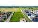 Community aerial showcasing a playground, green space, walking path, and newly constructed homes at 1500 Sun Way, Lafayette, CO 80026