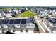 Townhouse complex showcases a modern community with solar panels, garages, and landscaped common areas at 1500 Sun Way, Lafayette, CO 80026