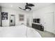 Comfortable bedroom with modern decor, TV, artwork, and multiple doorways at 1500 Sun Way, Lafayette, CO 80026