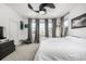 Cozy bedroom with soft carpet, gray curtains and lots of natural light at 1500 Sun Way, Lafayette, CO 80026