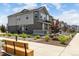 Beautiful two-story townhouse featuring a well-kept yard with charming landscaping and a welcoming front porch at 1500 Sun Way, Lafayette, CO 80026