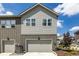 Exterior view of a two-story home with a gray siding and attached garage at 1500 Sun Way, Lafayette, CO 80026