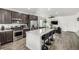 Spacious kitchen with a large island, open to the living room, stainless appliances at 1500 Sun Way, Lafayette, CO 80026