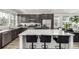 Modern kitchen with stainless steel appliances, a large island, and sleek countertops at 1500 Sun Way, Lafayette, CO 80026