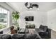 Bright living room featuring a modern ceiling fan, ample seating and natural light at 1500 Sun Way, Lafayette, CO 80026