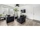 Modern living room boasting wood floors, a ceiling fan, and contemporary decor at 1500 Sun Way, Lafayette, CO 80026