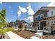Exterior view of a townhome community with landscaped yards and sidewalks at 1500 Sun Way, Lafayette, CO 80026