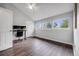 Bright bedroom featuring hardwood floors, vaulted ceiling, and natural lighting at 3889 S Fraser St, Aurora, CO 80014