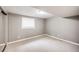 Unfurnished bedroom in basement featuring carpeted floors, neutral paint, and a single window at 3889 S Fraser St, Aurora, CO 80014