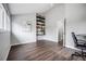 Versatile bonus room with hardwood floors, built-in shelving, and plenty of natural light at 3889 S Fraser St, Aurora, CO 80014