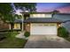 Charming two-story home with a brick facade and well-maintained lawn and a two car garage at 3889 S Fraser St, Aurora, CO 80014