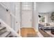 Inviting foyer with gleaming hardwood floors, high ceilings and lots of natural light at 3889 S Fraser St, Aurora, CO 80014