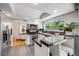 Well-lit kitchen with stainless steel appliances, granite countertops, and a breakfast bar at 3889 S Fraser St, Aurora, CO 80014