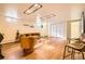 Finished basement with a modern sectional, accent chairs, and barn doors at 4401 S Yosemite Ct, Greenwood Village, CO 80111