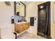 Contemporary bathroom with a modern vanity, designer fixtures, and walk-in shower at 4401 S Yosemite Ct, Greenwood Village, CO 80111