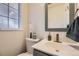 Modern half-bath featuring contemporary vanity and decorative fixtures at 4401 S Yosemite Ct, Greenwood Village, CO 80111