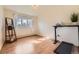 Bright bedroom featuring a window, ladder shelf and space for a standing desk with a printer at 4401 S Yosemite Ct, Greenwood Village, CO 80111