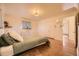 Large bedroom with a private entrance to the bathroom, closet, and hardwood floors at 4401 S Yosemite Ct, Greenwood Village, CO 80111