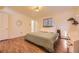 Inviting bedroom with large windows, modern lighting, and new hardwood floors at 4401 S Yosemite Ct, Greenwood Village, CO 80111