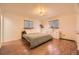 Bright bedroom with large windows, modern lighting, and new hardwood floors at 4401 S Yosemite Ct, Greenwood Village, CO 80111