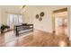 Well-lit dining room with wood floors, a rustic dining table, and elegant decor at 4401 S Yosemite Ct, Greenwood Village, CO 80111