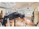 Spacious garage featuring a Cybertruck, decorative lighting, and epoxy flooring at 4401 S Yosemite Ct, Greenwood Village, CO 80111