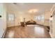 Cozy living room features a decorative fireplace, large windows, and hardwood floors at 4401 S Yosemite Ct, Greenwood Village, CO 80111