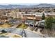 An aerial view of the home, showcasing its neighborhood and proximity to nearby community school at 13586 W Warren Cir, Lakewood, CO 80228