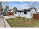 Backyard of home features a pergola and partial green space at 13586 W Warren Cir, Lakewood, CO 80228