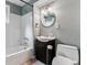 Updated bathroom with tub/shower combo, vanity and commode at 13586 W Warren Cir, Lakewood, CO 80228