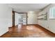 Bright bedroom with hardwood flooring, built-in shelves and natural light at 13586 W Warren Cir, Lakewood, CO 80228