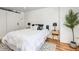 Cozy bedroom design features a queen bed, barn door closet, and decorative plant at 1250 N Humboldt St # 202, Denver, CO 80218