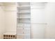Custom walk-in closet with hanging racks, drawers, shelves, and shoe storage at 1250 N Humboldt St # 202, Denver, CO 80218