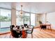 Bright dining area with stylish chandelier and access to balcony at 1250 N Humboldt St # 202, Denver, CO 80218