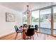 Cozy dining room with modern lighting and sliding glass door to balcony at 1250 N Humboldt St # 202, Denver, CO 80218