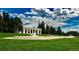 Picturesque park with stunning Greek-style architecture, manicured lawns, mature trees, and bright blue skies at 1250 N Humboldt St # 202, Denver, CO 80218