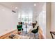 Open living area with dining space and large glass doors to balcony at 1250 N Humboldt St # 202, Denver, CO 80218