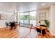 Bright living space features a dining area and a home office nook with access to a large balcony at 1250 N Humboldt St # 202, Denver, CO 80218