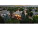Aerial view of the home and surrounding landscape, showcasing its backyard and outdoor deck at 9232 Rockport Ln, Highlands Ranch, CO 80126